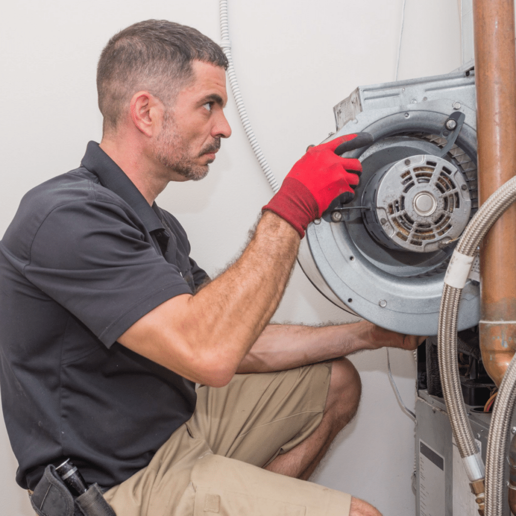 a service technician installing a residential heating system